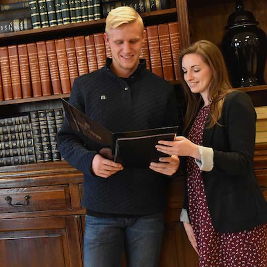 Students smiling while reading